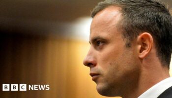 Paralympic track star Oscar Pistorius stands in the dock during his trial at the North Gauteng High Court in Pretoria, in 2014.