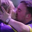 A kiss for the winner! Luke 'the Nuke' Littler, 16, receives a peck from a mystery blonde, poses for selfies and is 'stung by the Ally Pally wasp' as he storms his way to the World Darts Championship semi-final