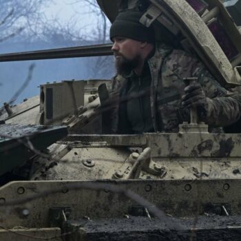 A Ukrainian serviceman of the 47th Mechanized Brigade prepares for combat a Bradley fighting vehicle, not far away from Avdiivka, Donetsk region on February 11, 2024, amid the Russian invasion of Ukraine. (Photo by Genya SAVILOV / AFP)