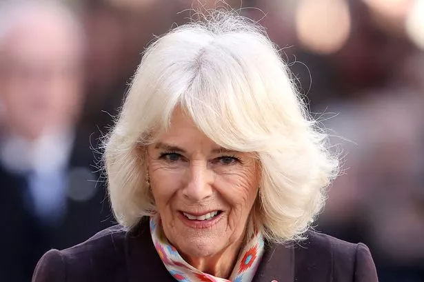 Queen Camilla's surprise reaction after guest drops name badge as she chats to them