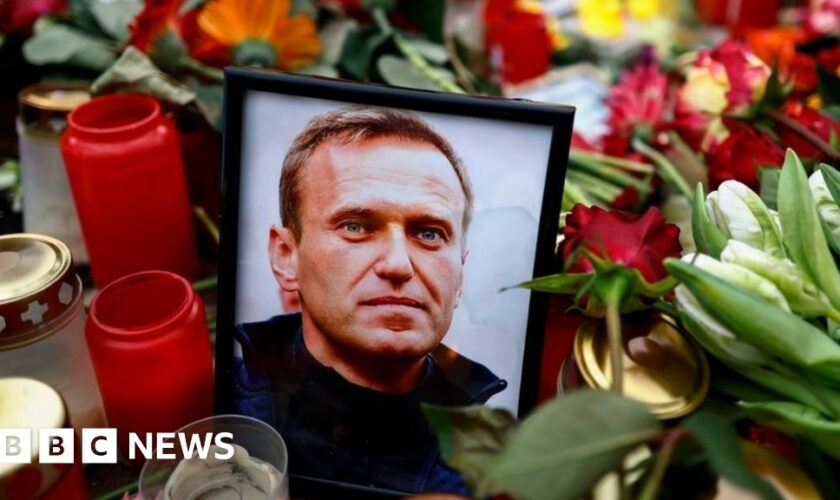 A picture of Alexi Navalny is surrounded by flowers