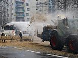 We're coming for EU! Moment striking farmers ram their tractors through blockade sending riot police fleeing near European Union's Brussels HQ before riot cops unleash water cannons amid row over bloc's policies