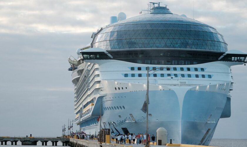 Tourists leave the Royal Caribbean's Icon of the Seas, the largest cruise ship in the world, after arriving at Costa Maya Cruise Port, in the village town of Mahahual, Quintana Roo state, Mexico