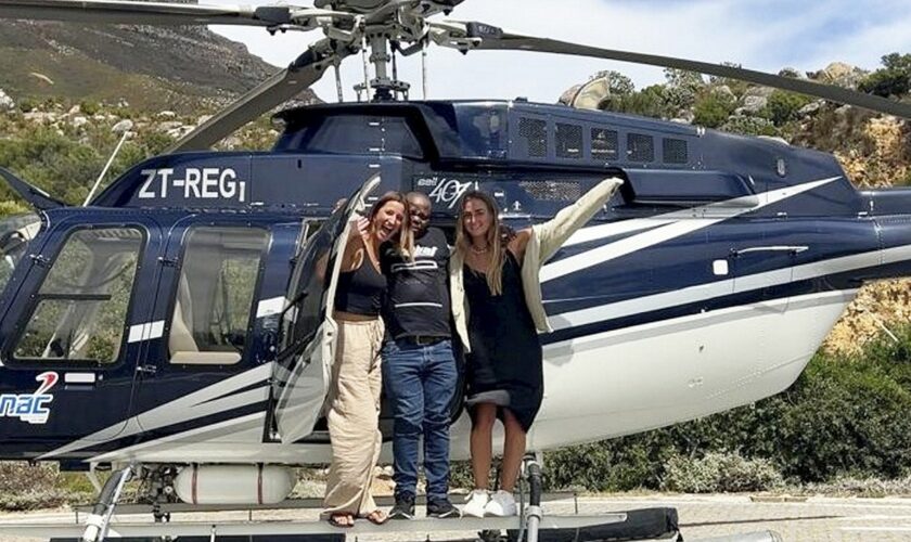 World travelers surprise security guard with helicopter ride over South Africa: ‘Big smile on his face'