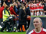 Arsenal star Frida Maanum collapses off the ball and receives treatment from paramedics during worrying scenes at the Women's League Cup final... with the game delayed as she was carried off on a stretcher
