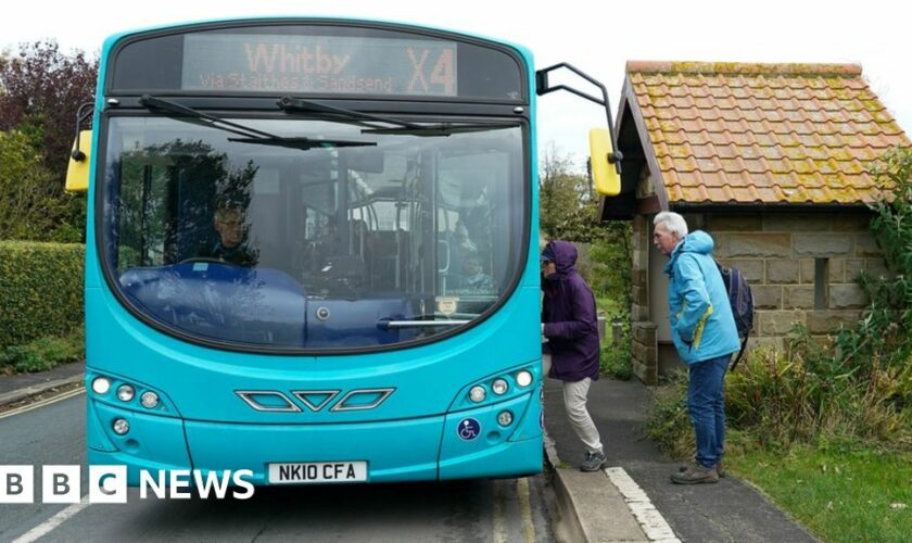 People boarding a bus in Whitby