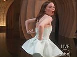 Emma Stone suffers wardrobe malfunction on stage as she accepts Oscar for Poor Things - after beating  Lily Gladstone: 'My dress is broken!'