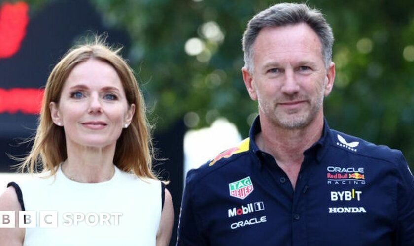 Red Bull F1 team boss Christian Horner and wife Geri kiss before the first race of the season