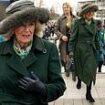 Queen Camilla is gorgeous in green as she joins  Zara Tindall and Princess Eugenie for 'Style Wednesday' at the Cheltenham Festival (and the Tindalls can't resist a quick kiss)