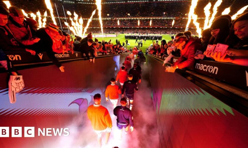 Rugby players enter the pitch for a Six Nations match in Cardiff