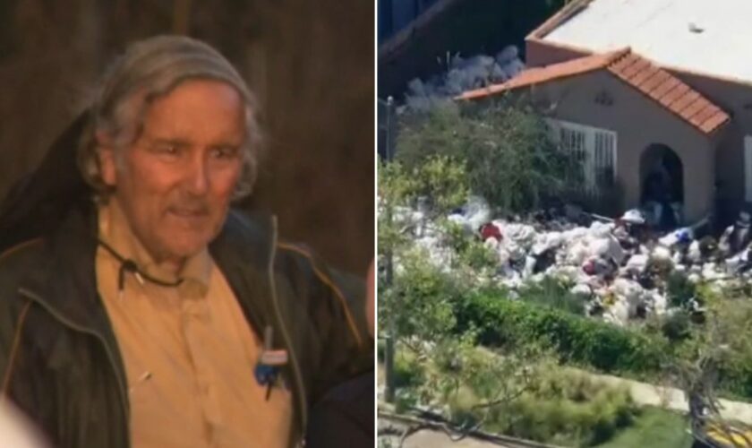 Los Angeles 'trash house' owner seen outside as city cleans up property