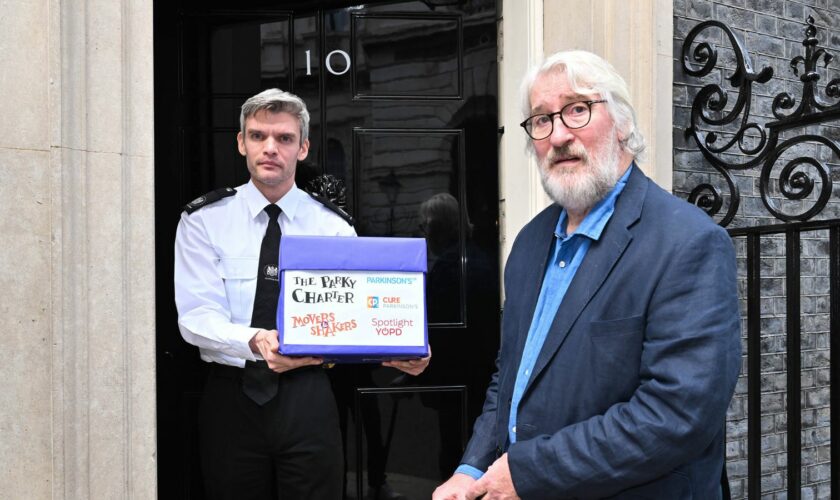 Jeremy Paxman marked World Parkinson's Day by handing over the Parky Charter petition to Number 10. Pic: PA