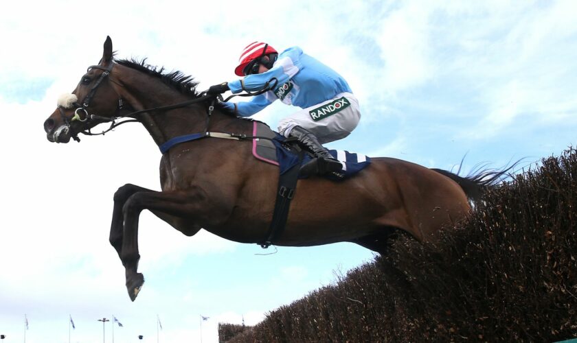 Cruz Control ridden by Stan Sheppard on their way to winning the William Hill Handicap Chase on day three of the 2024 Randox Grand National. Pic: PA