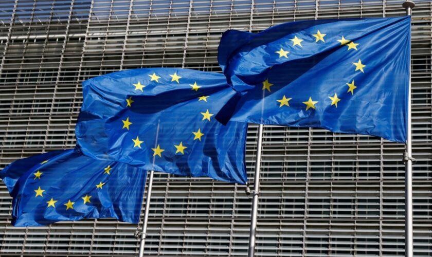 FILE PHOTO: European Union flags flutter outside the EU Commission headquarters in Brussels, Belgium June 17, 2022. REUTERS/Yves Herman/File Photo