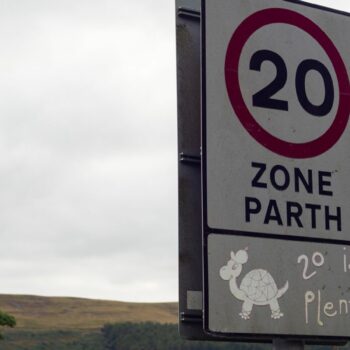 20 mph speed limit sign on public road, near a school, driving safety. Pic: iStock (steved_np3)
