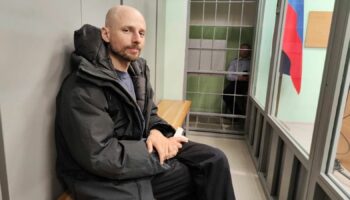 Russian journalist Sergey Karelin appears in court in the Murmansk region of Russia, Saturday April 27, 2024, after his arrest on “extremism” charges, which he denied. (AP Photo)