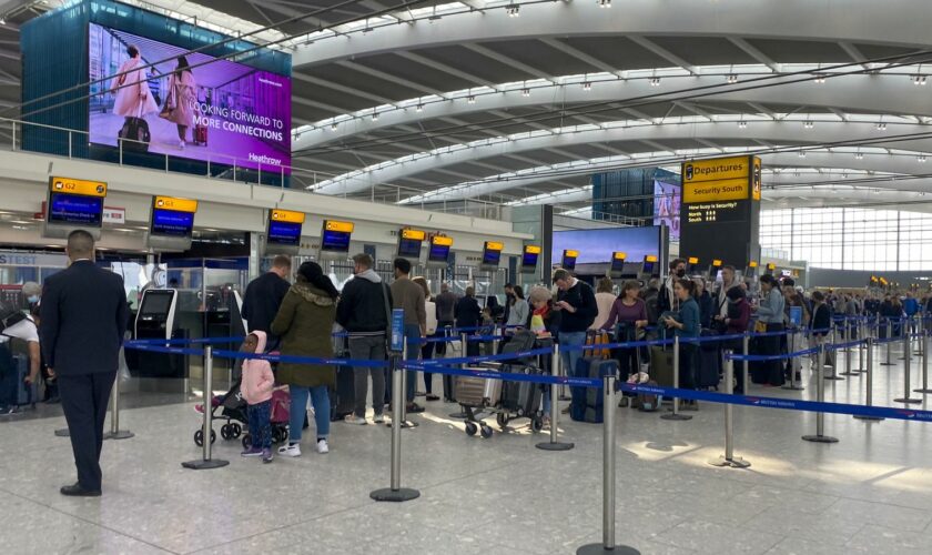 Passengers queue in Heathrow Airport. Pic: PA