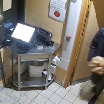 Bizarre moment hungry burglar is caught on CCTV stealing food from McDonald's