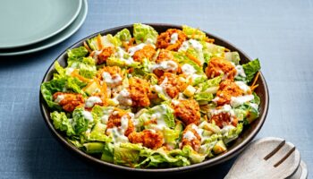 Crispy Buffalo chicken bites add loads of flavor to this crunchy salad