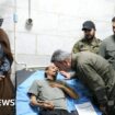 PMF chief of staff (C-R) visits a man wounded in the explosion at a hospital