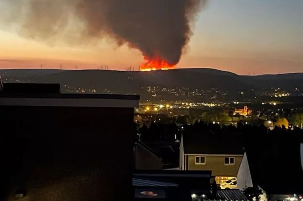 Huge fire breaks out on hillside near Swansea with orange flames seen from miles away