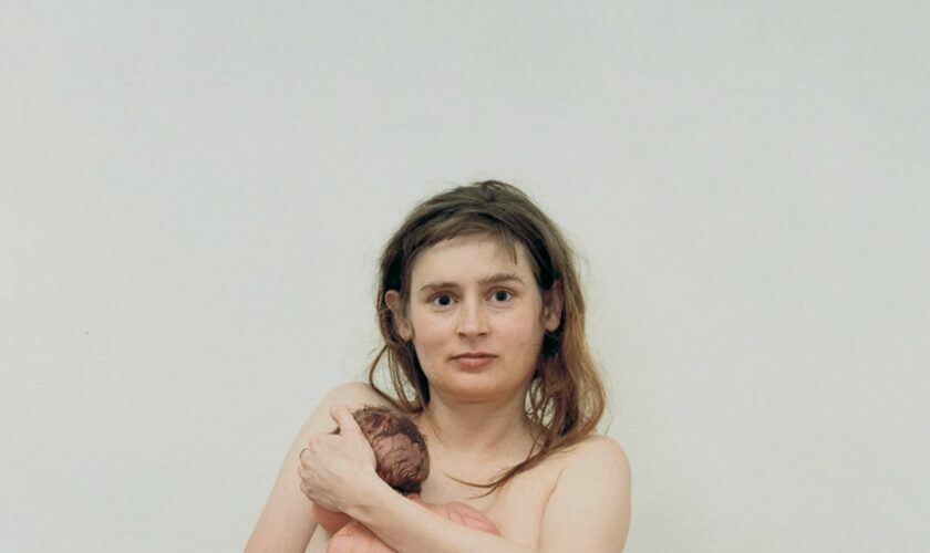 In one photo, a naked depiction of the bravery of motherhood