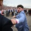Ladies Day turns ugly (for the boys): Brawl breaks out at Aintree as bloodied male racegoers throw punches at each other in the stands after huge crowds enjoyed a day on the booze