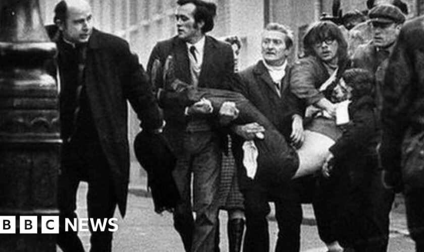 A victim of Bloody Sunday is carried through the streets of Derry