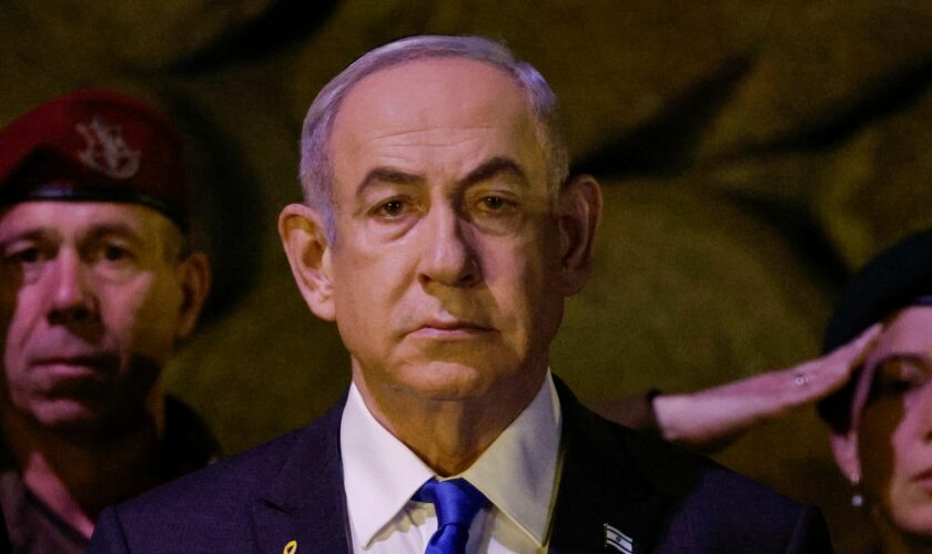Israeli Prime Minister Benjamin Netanyahu, front, attends a wreath-laying ceremony marking Holocaust Remembrance Day in the Hall of Remembrance at Yad Vashem, the World Holocaust Remembrance Centre, in Jerusalem, Israel, Monday, May 6, 2024. (Amir Cohen/Pool Photo via AP)