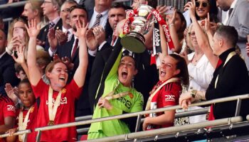 Manchester United goalkeeper Mary Earps and midfielder Ella Toone lifted the trophy. Pic: PA