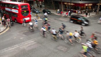 Commuter cyclists set off from a green light at a busy road junction in Central London. Pic: iStock