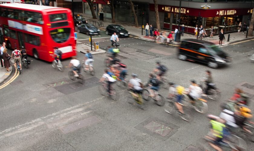 Commuter cyclists set off from a green light at a busy road junction in Central London. Pic: iStock
