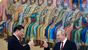 The Russian and Chinese leaders toasting during a dinner last year. Pic: AP