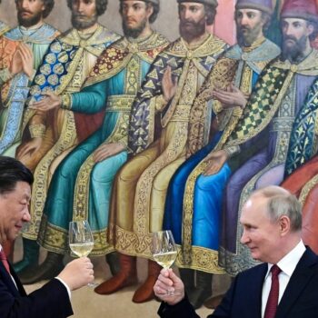 The Russian and Chinese leaders toasting during a dinner last year. Pic: AP