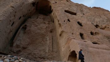 A Taliban soldier stands guard in front of the ruins of a 1500-year-old Buddha statue in Bamiyan. File pic: Reuters