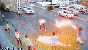 Fire-breather fights off marauding mariachis in 'turf war over tips'