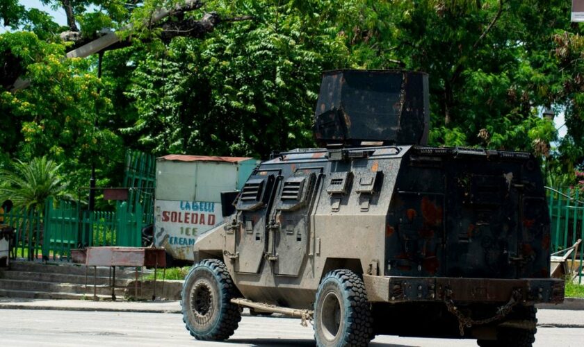 A police tank patrols the area where armed gangs have spread terror, in Port-au-Prince, Haiti, on May 24, 2024.