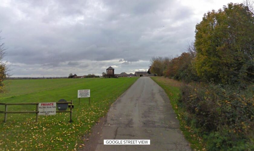 A man has died after a collision between two gliders at an airfield at Hinton-in-the-Hedges . Pic: Google Street View