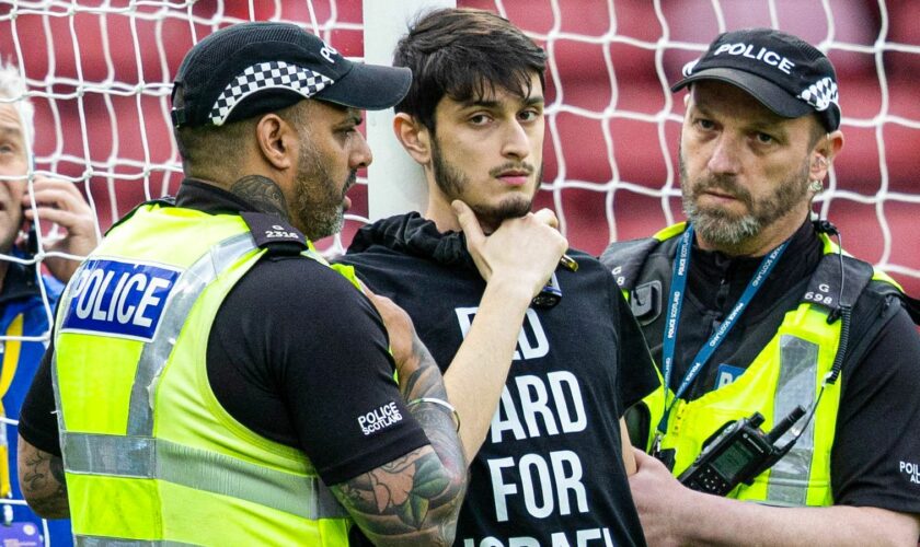Protester locked himself to the goal post in protest against Israel during a Euros qualifier between Scotland and Israel at Hampden Park, on May 31, 2024, in Glasgow, Scotland. Pic: SNS Group
