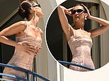 Bella Hadid is the ultimate Cannes balcony bombshell as she poses up a storm at her hotel after stealing the show with THAT red carpet outfit