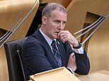 Fury as SNP leader John Swinney attacks 'prejudiced' decision to suspend ally Michael Matheson over scandal that saw MSP run up £11,000 data bill on his taxpayer-funded iPad by letting his kids watch football during African holiday