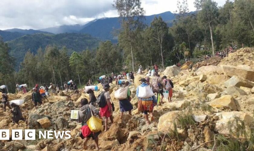 Race to rescue villagers trapped after landslide