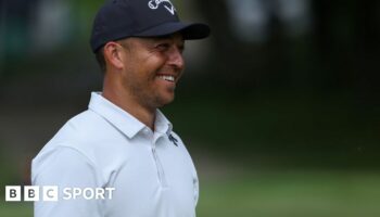 Xander Schauffele smiles while playing at the US PGA Championship