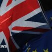 A Union flag, also known as Union Jack, left, and a European Union (EU) flag fly during a Unite for Europe march to protest Brexit in central London, U.K.