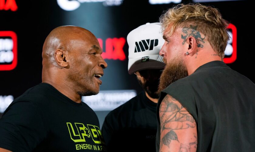 Mike Tyson, left, and Jake Paul, right, face off during a news conference promoting their upcoming boxing bout, Thursday, May 16, 2024, in Arlington, Texas. Pic: AP Photo/Sam Hodde