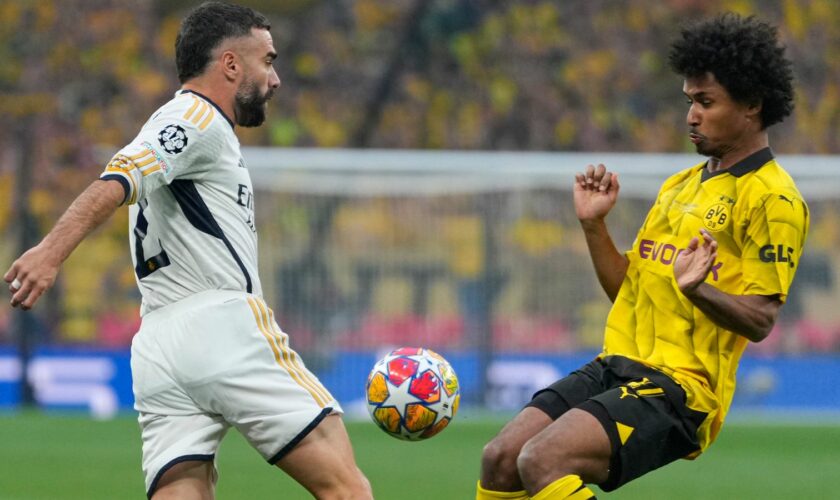 Real Madrid's Dani Carvajal challenges for the ball with Dortmund's Karim Adeyemi during the Champions League final. Pic: AP