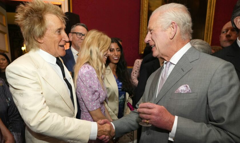 The King greeting Sir Rod Stewart. Pic: PA