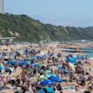 People enjoying the sunny weather on Bournemouth Beach in Dorset. Picture date: Sunday June 23, 2024.