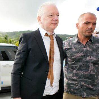 Julian Assange arrives at the United States courthouse in Saipan Pic: AP