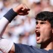 Carlos Alcaraz raises his fist in celebration